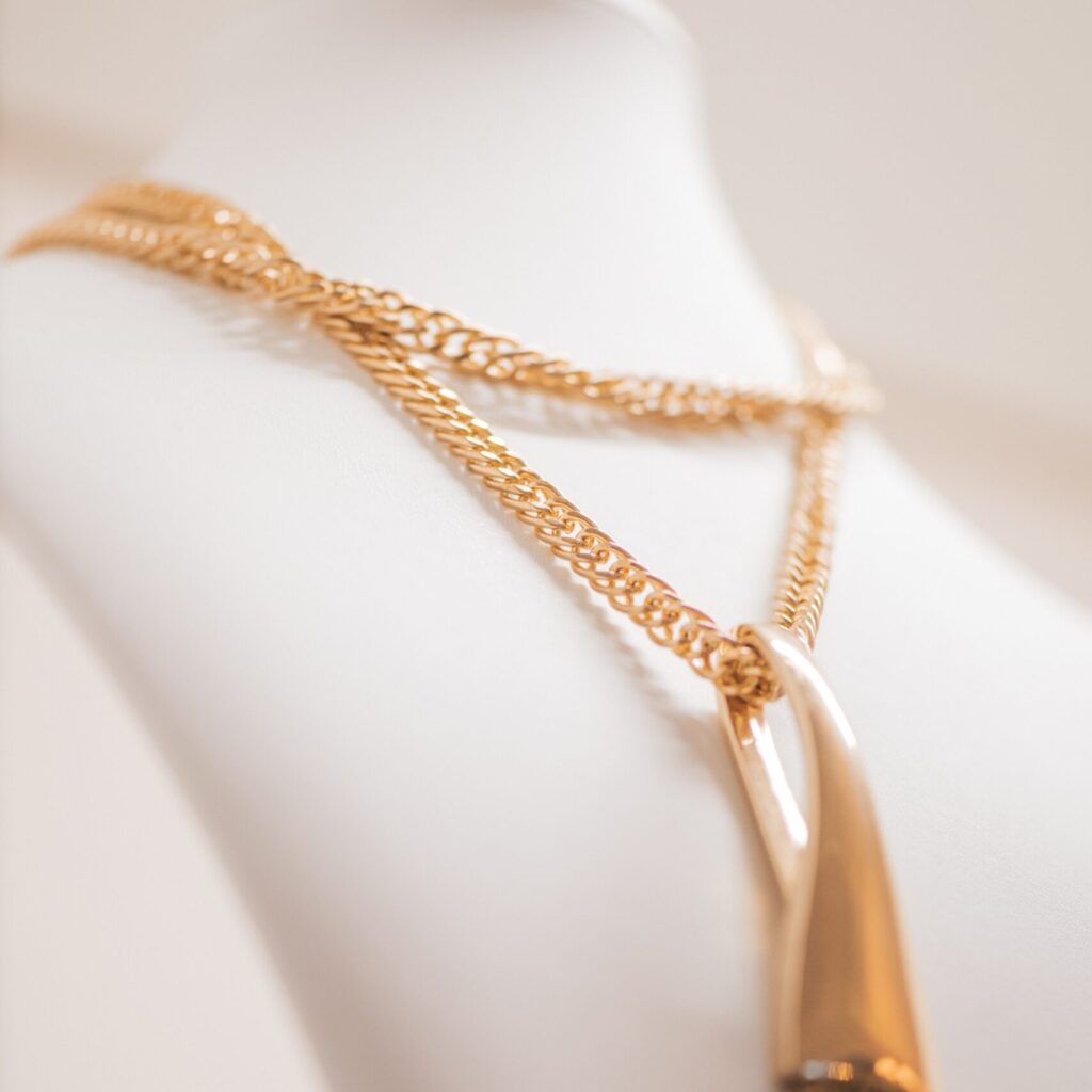 Amaranth dressing room boutique copy space boudoir table peach ecru apricot.Elegance interior with console table lavender blush modern in coral puce soft-hued neutral.Beautiful art mannequin heads on wardrobe shelves with beads from platinum silver for stylish fashion girl fashionista jewelry various set holders with gold chain jewelry.?lose-up beautiful jewelery diamonds pearl necklace earrings rings bracelets in jewelry box.Paper bag Chanel shop shopping on women table near mirror and candles