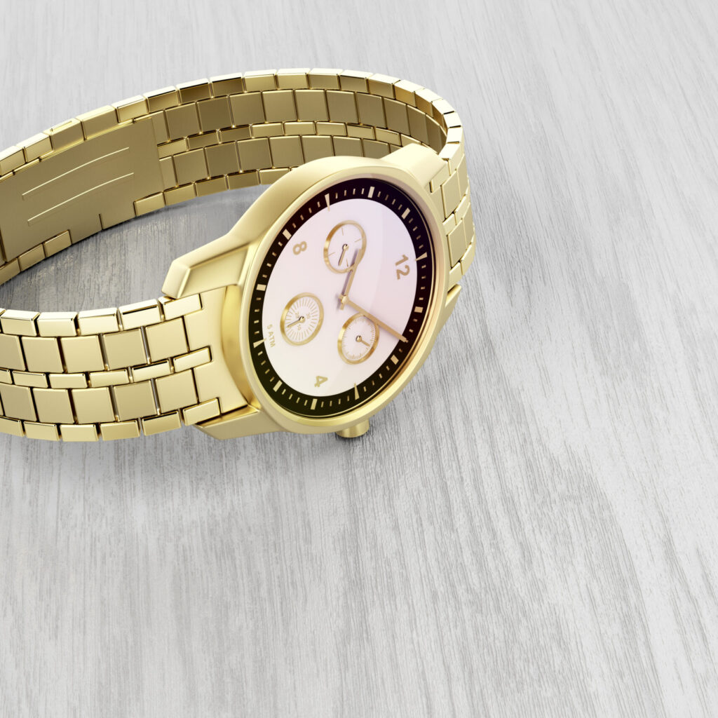 Luxury gold wrist watch on wood background